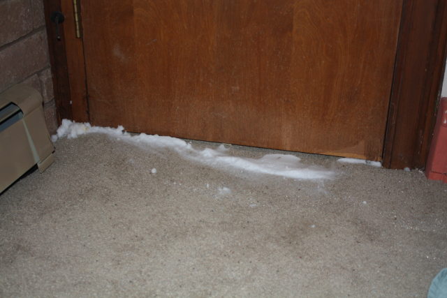 [Snow coming under the bedroom door]