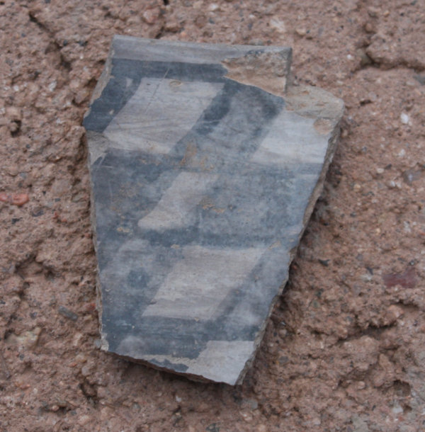 [Pot sherd we found in the yard]