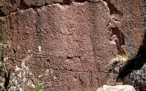 [Petroglyphs on the rim of Alamo Canyon]