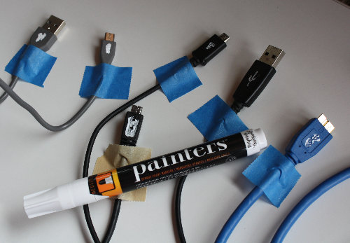 [USB cables painted for orientation]