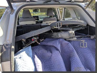 [Two bikes packed into the back of a Rav4]