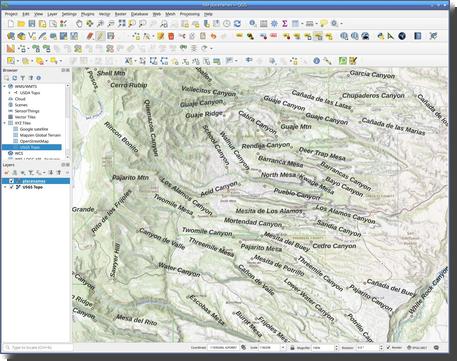 [Screenshot of QGIS showing features labeled in large font bold letters slanted to match canyons and mesas]