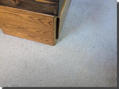 [The wooden corner of a bed frame, easy to knock your toes against]