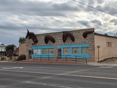 [a fun building in Clayton NM with a dragon embedded in it]